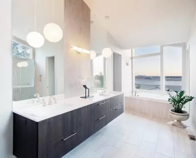 The Bathroom with wooden furniture and luxuries countertop granite at Littleton, CO