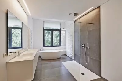 The Modern luxury bathroom with bathtub and lighting at Littleton, CO