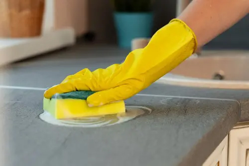 The gloved person cleaning at Durango, CO.