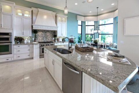 Glossy granite kitchen with blue walls