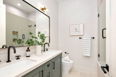 A bathroom with a mirror and sink